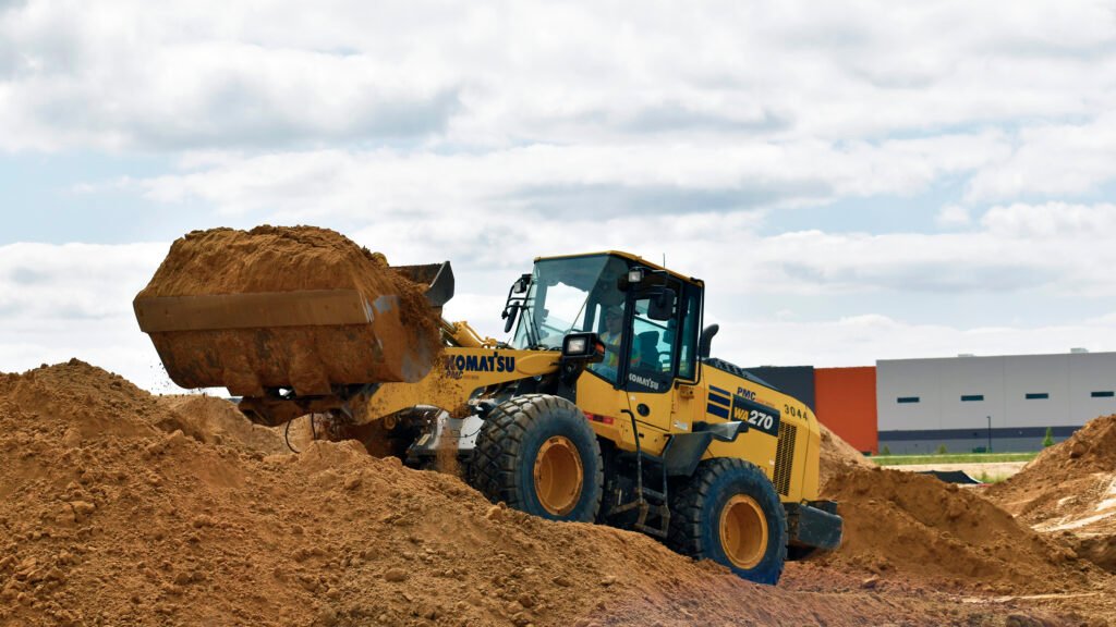 Loader moving earth on job site